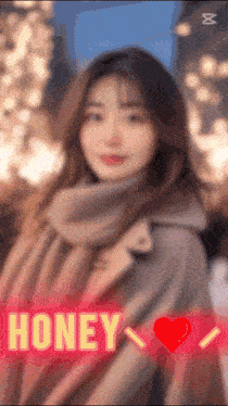 a blurred image of a woman with the word honey in the foreground