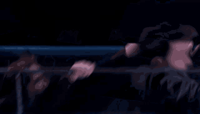 a man and woman are riding a roller coaster and the woman is holding onto the railing
