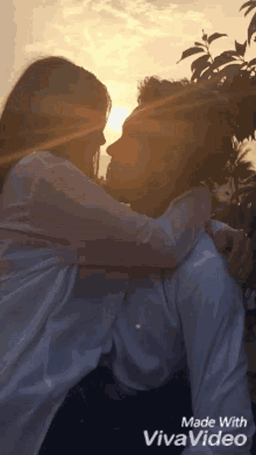 a silhouette of a man and woman hugging with the words made with vivavideo below