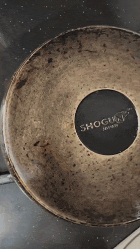 the bottom of a shogun japan pot sits on a table