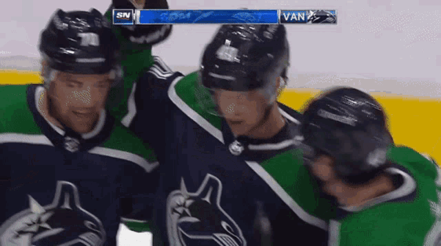 a hockey game is being played between the vancouver canucks and the new york islanders