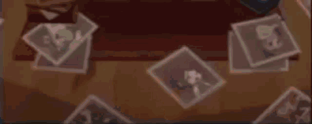 a pixel art of a girl with a tiara on her head is sitting at a table .