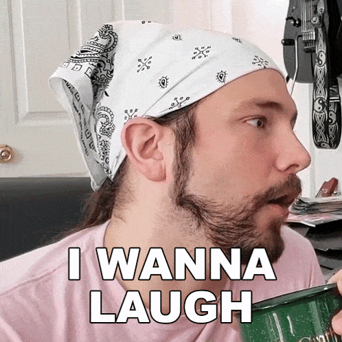 a man wearing a bandana on his head says i wanna laugh