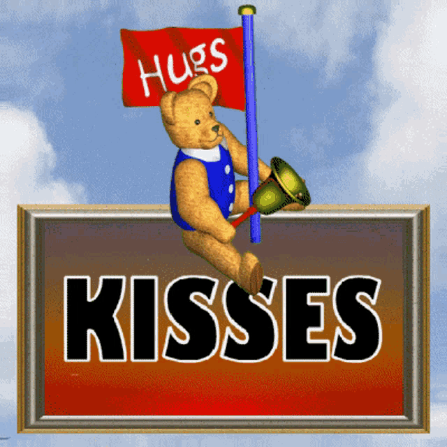 a teddy bear holding a flag that says hugs