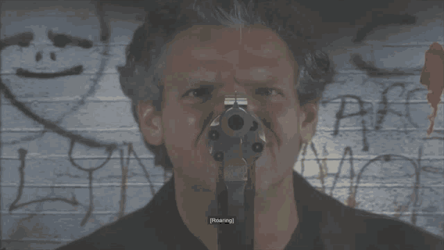 a man is holding a flashlight in front of his face and the word roaring is on the bottom right