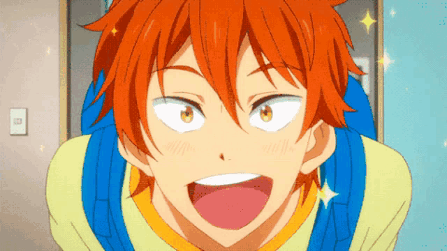 a close up of a boy with orange hair and a yellow shirt