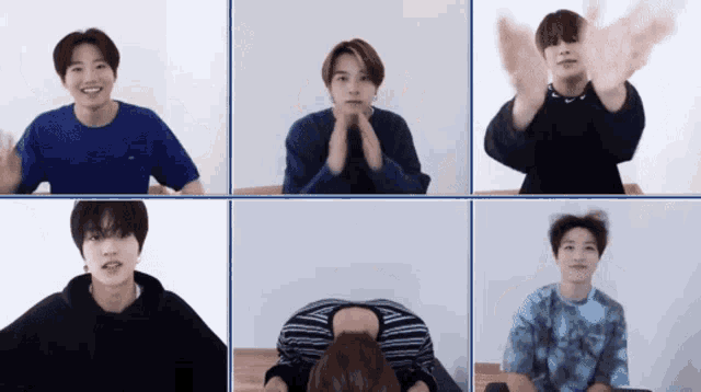 a group of young men are sitting in front of a screen and making different faces .