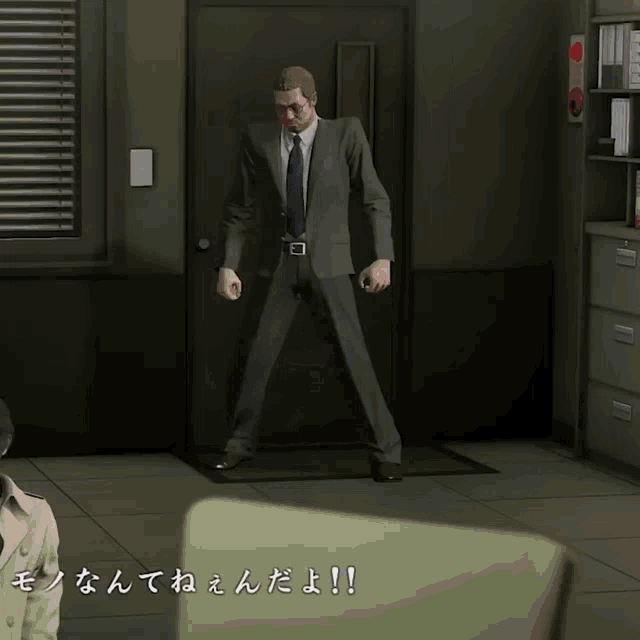 a man in a suit and tie is standing in front of a door with chinese writing on the floor