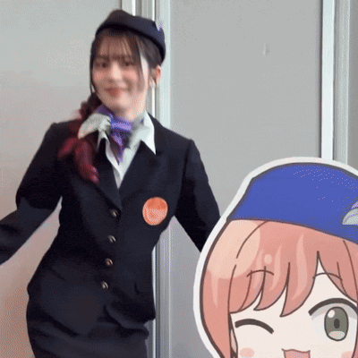 a woman in a suit stands next to a cardboard cutout of a girl with green eyes