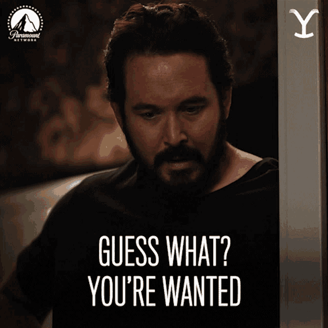 a man with a beard says guess what you 're wanted in a paramount network ad