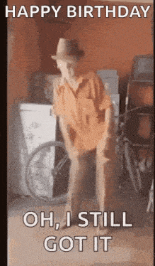 a man in a hat is dancing in a garage .