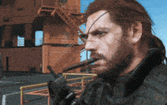 a man with a beard is holding a gun in his hand