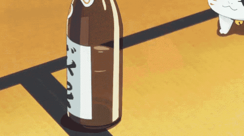 a bottle with a label that says ' t ' on it is on the floor
