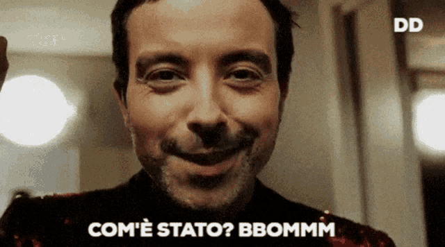 a close up of a man 's face with the words " com ' e stato ? bbommm " written below