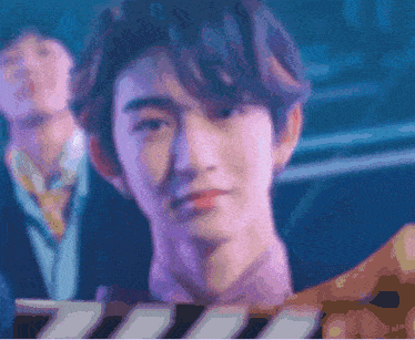 a close up of a man 's face in a blurry picture