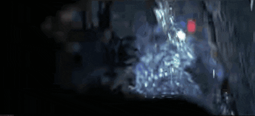 a blurred image of a person holding a gun