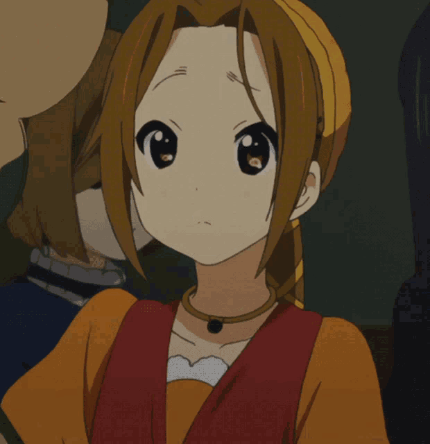 a close up of a girl 's face with her hand on her face