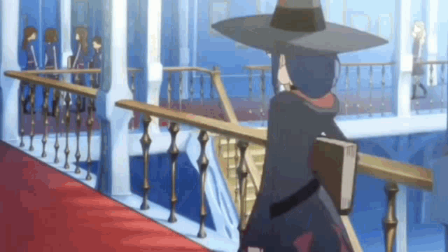 a witch is sitting on a balcony holding a book and looking at a group of people .