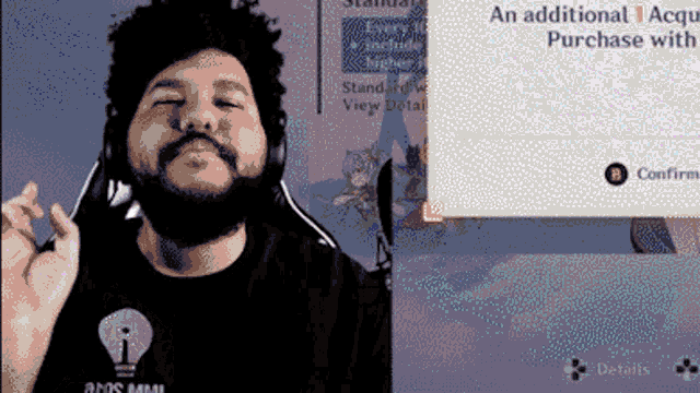 a man with a beard wearing headphones and a shirt that says aos mini