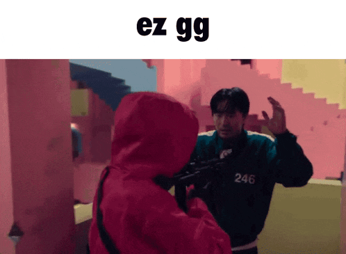a man in a red hoodie is holding a gun next to a man in a black jacket with the number 246 on it