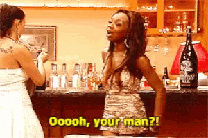 a woman in a white dress is standing in front of a bar and says oooh your man