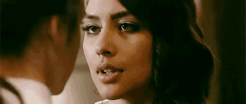 a close up of a woman 's face looking at another woman 's face .
