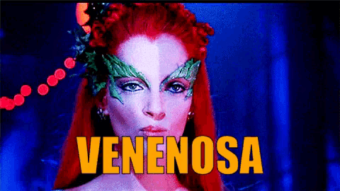 a pixelated image of a woman with red hair and the word venenosa in yellow letters