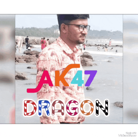 a man wearing glasses is standing on a beach with the words ak47 dragon behind him