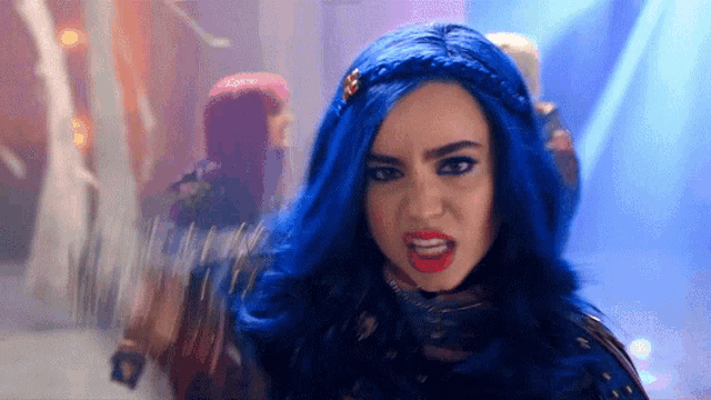 a woman with blue hair making a funny face