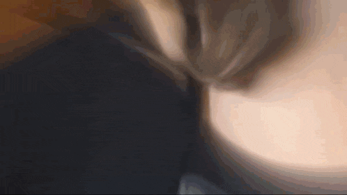 a close up of a person 's ear with a black background .