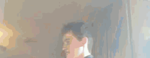 a close up of a person 's head in a room with smoke coming out of the window .
