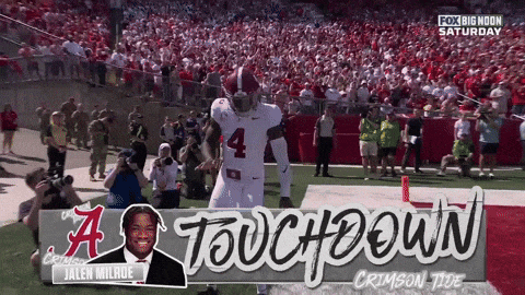 a football player with the number 4 on his jersey stands on the field