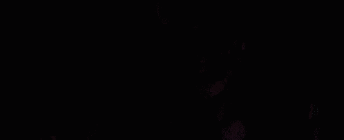 it is a close up of a person 's eyes in the dark .