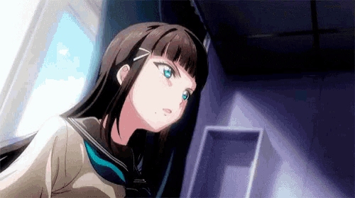 a girl in a school uniform is standing in a dark room looking up .
