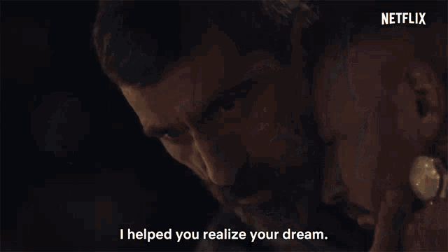 a man with a beard is hugging another man and saying `` i helped you realize your dream . ''