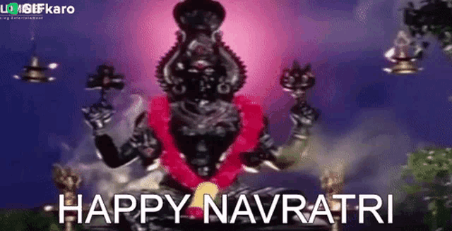 a black statue of a deity with the words `` happy navratri '' written on it .