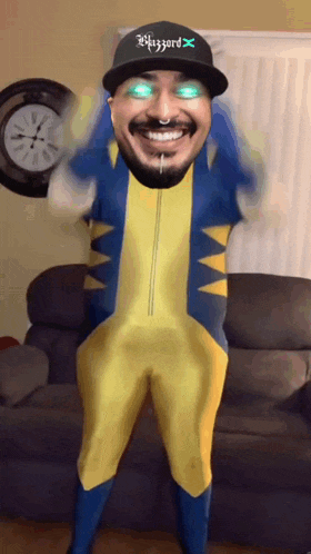 a man in a yellow and blue superhero costume with a hat that says blitzzard x