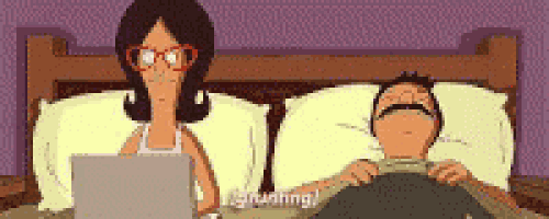 a cartoon of a woman sitting in front of a laptop next to a man in bed .