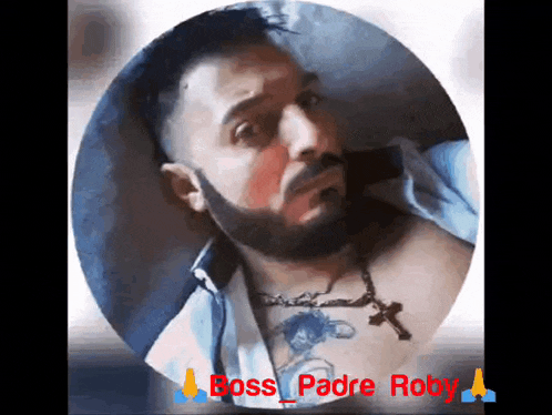 a man with a beard and a cross on his chest has the name boss padre roby on the bottom
