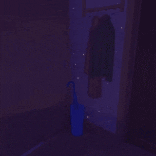 a person is laying on the floor in a dark room with purple lights .