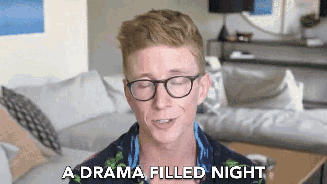 a man wearing glasses is talking about a drama filled night