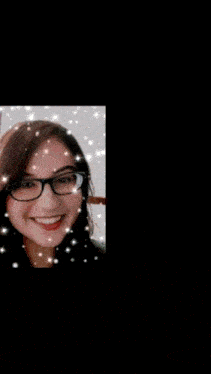 a blurry picture of a woman wearing glasses with a black background