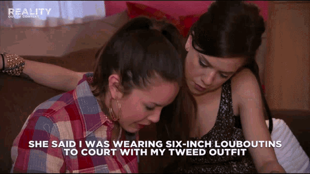 two women sit on a couch and one of them says she said i was wearing six-inch louboutins