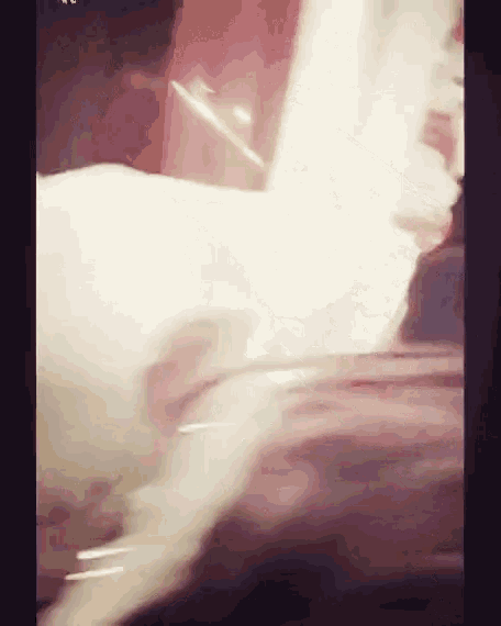 a blurred image of a person 's face with a few lines visible