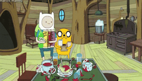 a cartoon of finn and jake sitting at a table with food