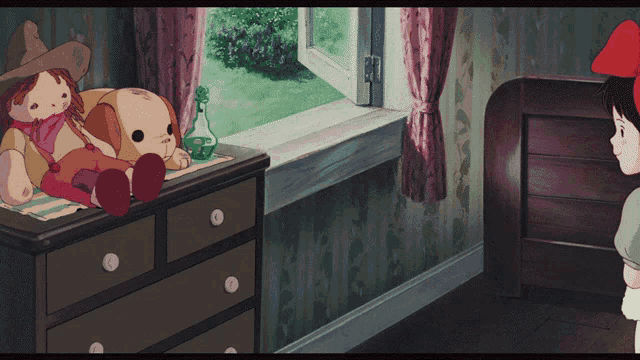 a doll sits on a dresser in a room with a window