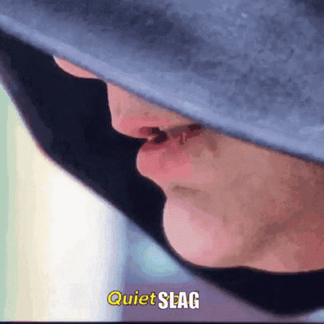 a close up of a person 's face with the words quiet seag written above it