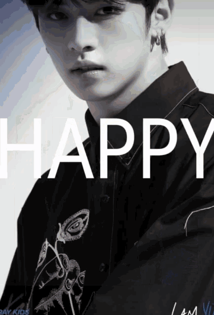 a black and white photo of a young man with the words happy written above him
