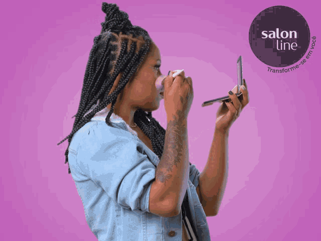 a woman is applying makeup in front of a purple background that says salon line