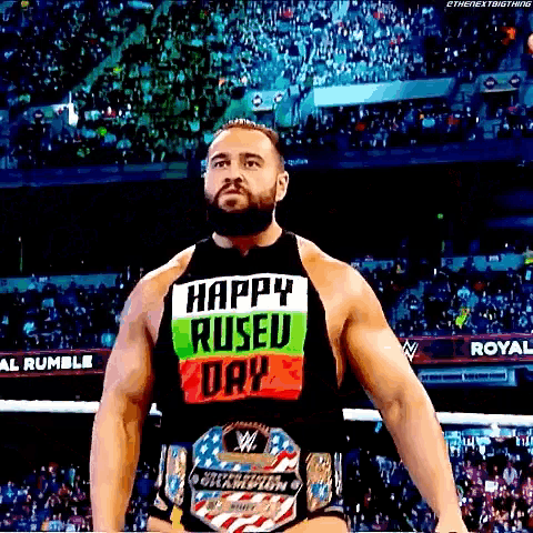 a wrestler is wearing a shirt that says happy ruseu day